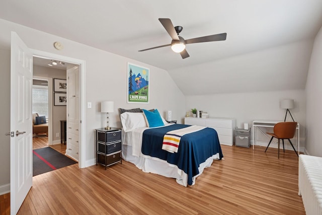 5117 48th St, Edina, MN 55436 - bedroom featuring light wood-type flooring, baseboards, vaulted ceiling, and a ceiling fan