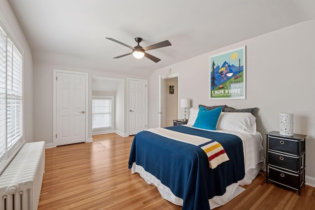 5117 48th St, Edina, MN 55436 - bedroom featuring radiator, wood finished floors, baseboards, and ceiling fan