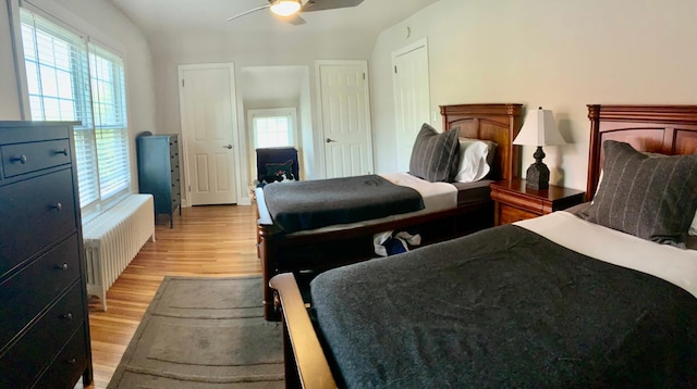 5117 48th St, Edina, MN 55436 - bedroom with radiator, light wood-style floors, and ceiling fan