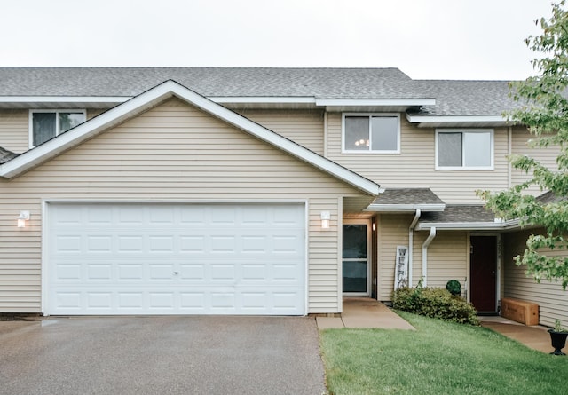 2778 Ridgeview Ln, Red Wing, MN 55066 - townhome / multi-family property with driveway, roof with shingles, a garage, and a front yard