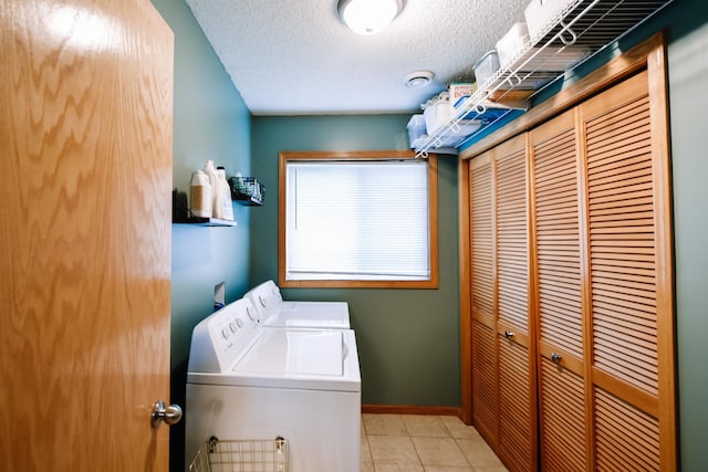 2778 Ridgeview Ln, Red Wing, MN 55066 - washroom with washer and clothes dryer, tile patterned flooring, a textured ceiling, and baseboards