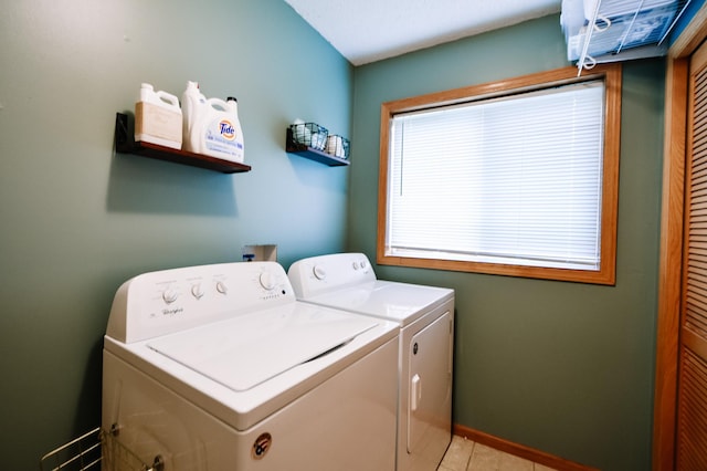 2778 Ridgeview Ln, Red Wing, MN 55066 - laundry area featuring washer and clothes dryer, baseboards, and light tile patterned floors