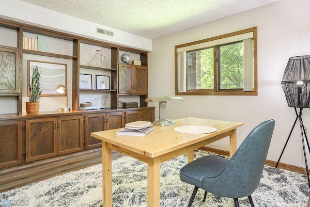 220 8th St S Unit B2, Fargo, ND 58103 - office with light wood-type flooring, a textured ceiling, and baseboards