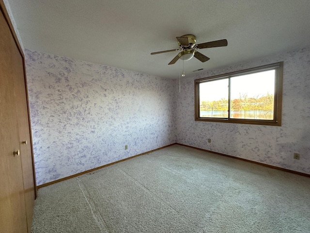 39 Round Lake Trl, Little Canada, MN 55117 - unfurnished room featuring carpet, a ceiling fan, and wallpapered walls