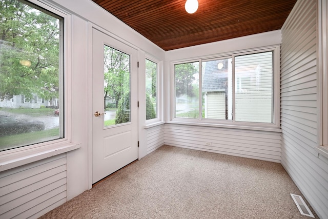919 Howard St, Winona, MN 55987 - unfurnished sunroom with wooden ceiling, carpet, and wood walls