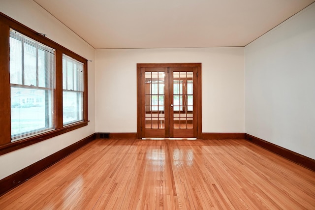 919 Howard St, Winona, MN 55987 - spare room with light wood-style floors, healthy amount of natural light, and baseboards