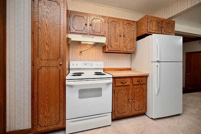 919 Howard St, Winona, MN 55987 - kitchen featuring white appliances, wallpapered walls, under cabinet range hood, brown cabinetry, and light countertops