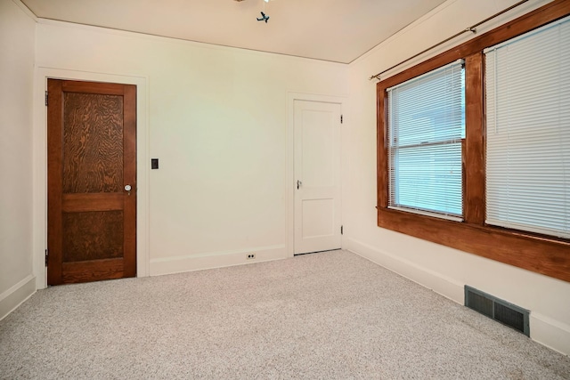 919 Howard St, Winona, MN 55987 - carpeted empty room featuring baseboards