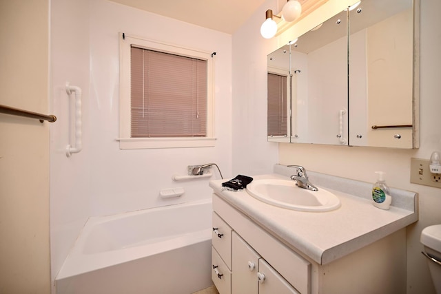 919 Howard St, Winona, MN 55987 - bathroom with a tub to relax in, vanity, and toilet