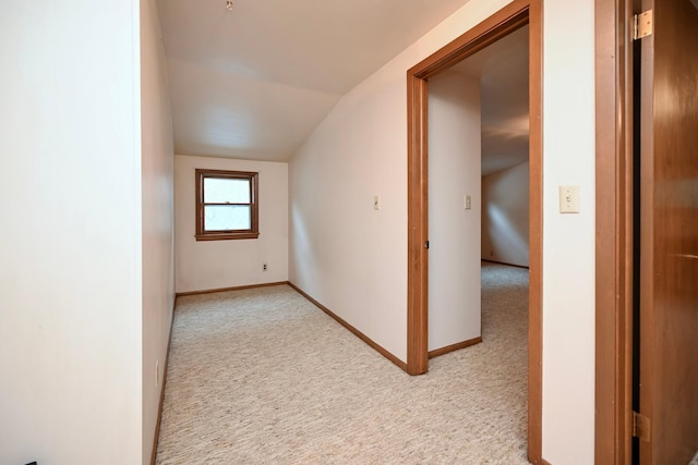 919 Howard St, Winona, MN 55987 - bonus room with light carpet, vaulted ceiling, and baseboards