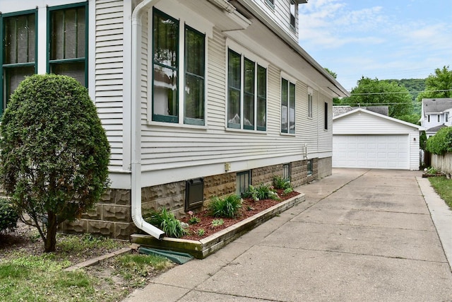 919 Howard St, Winona, MN 55987 - view of home's exterior with a detached garage and an outdoor structure