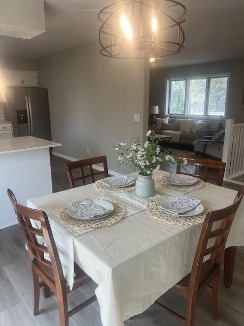 4207 Fillmore St NE, Columbia Heights, MN 55421 - dining room with a chandelier and wood finished floors