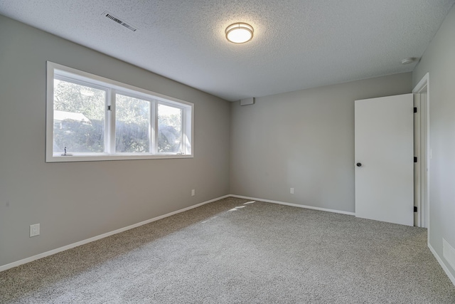 4207 Fillmore St NE, Columbia Heights, MN 55421 - empty room with a textured ceiling, carpet flooring, baseboards, and a smoke detector