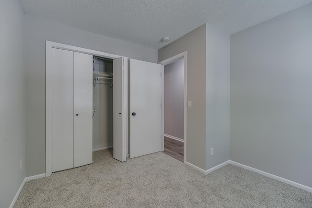 4207 Fillmore St NE, Columbia Heights, MN 55421 - unfurnished bedroom with carpet flooring, baseboards, a closet, and a textured ceiling