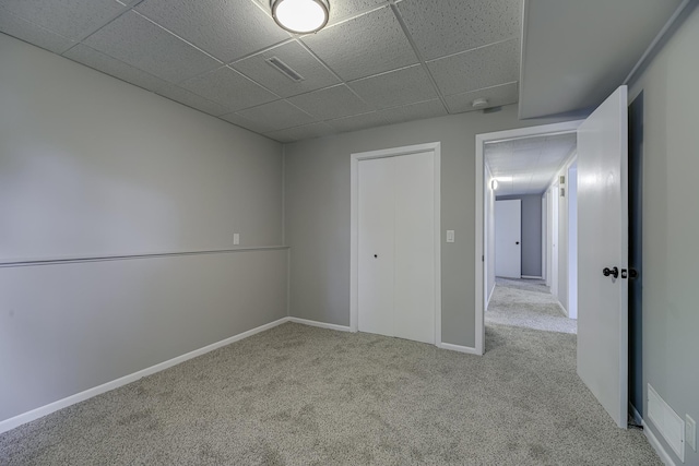 4207 Fillmore St NE, Columbia Heights, MN 55421 - unfurnished bedroom featuring a drop ceiling, carpet flooring, and baseboards