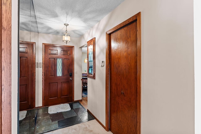 4017 Kentucky Ave N, Crystal, MN 55427 - foyer entrance with baseboards and a textured ceiling