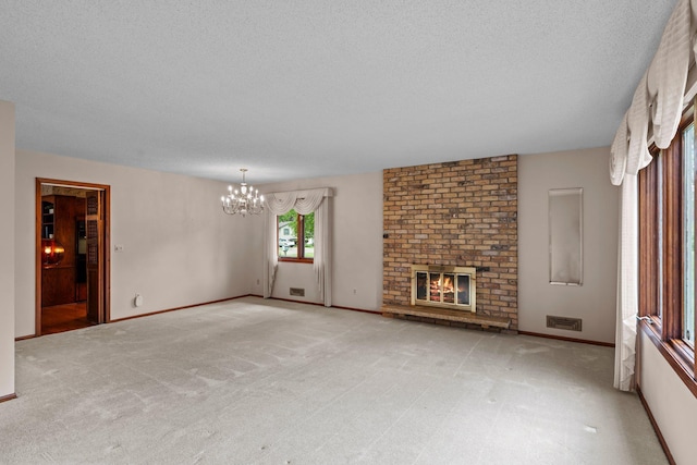 4017 Kentucky Ave N, Crystal, MN 55427 - unfurnished living room featuring a chandelier, a fireplace, a textured ceiling, light carpet, and baseboards