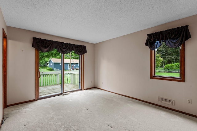 4017 Kentucky Ave N, Crystal, MN 55427 - carpeted spare room with baseboards and a textured ceiling