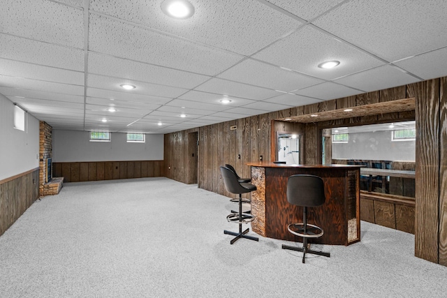 4017 Kentucky Ave N, Crystal, MN 55427 - indoor dry bar featuring wood walls, carpet, a drop ceiling, plenty of natural light, and wainscoting