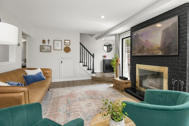 4721 Cedar Lake Rd S Unit 8, Saint Louis Park, MN 55416 - living room with stairway, wood finished floors, baseboards, a brick fireplace, and recessed lighting