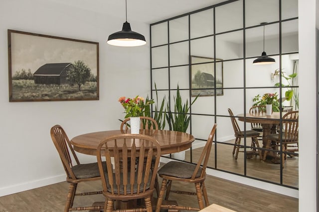 4721 Cedar Lake Rd S Unit 8, Saint Louis Park, MN 55416 - dining space featuring wood finished floors and baseboards