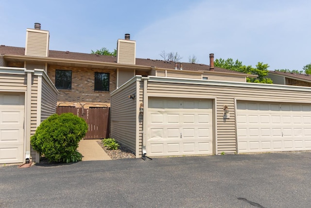 4721 Cedar Lake Rd S Unit 8, Saint Louis Park, MN 55416 - back of property featuring a chimney and brick siding