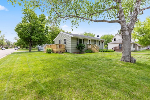 1224 N St NE, Brainerd, MN 56401 - view of front of property featuring a wooden deck and a front lawn