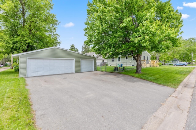 1224 N St NE, Brainerd, MN 56401 - view of front of home featuring a detached garage and an outdoor structure