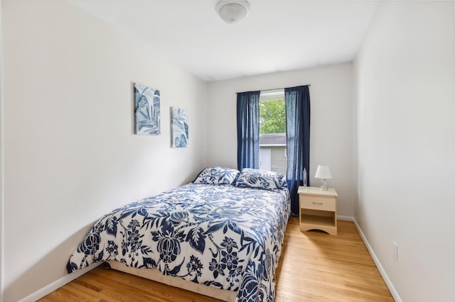 1224 N St NE, Brainerd, MN 56401 - bedroom featuring wood finished floors and baseboards