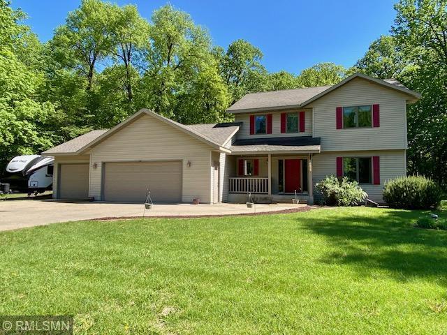 23110 Grandview Loop, Long Prairie Twp, MN 56347 - view of front of home with a porch, an attached garage, driveway, and a front yard
