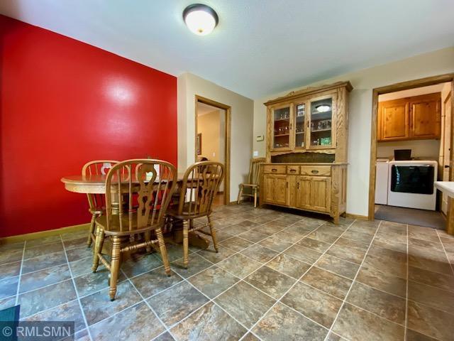 23110 Grandview Loop, Long Prairie Twp, MN 56347 - dining space with independent washer and dryer, baseboards, and stone finish flooring