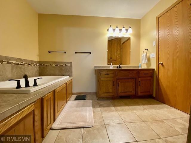 23110 Grandview Loop, Long Prairie Twp, MN 56347 - bathroom featuring vanity, tile patterned floors, and a bath