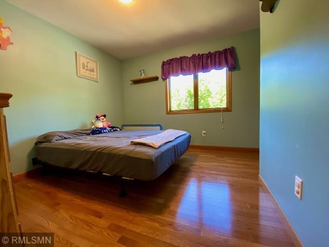 23110 Grandview Loop, Long Prairie Twp, MN 56347 - bedroom featuring wood finished floors and baseboards