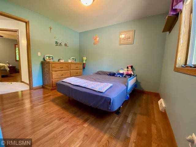 23110 Grandview Loop, Long Prairie Twp, MN 56347 - bedroom featuring wood finished floors and baseboards