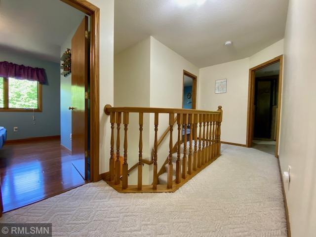 23110 Grandview Loop, Long Prairie Twp, MN 56347 - hall featuring an upstairs landing, baseboards, carpet floors, and wood finished floors