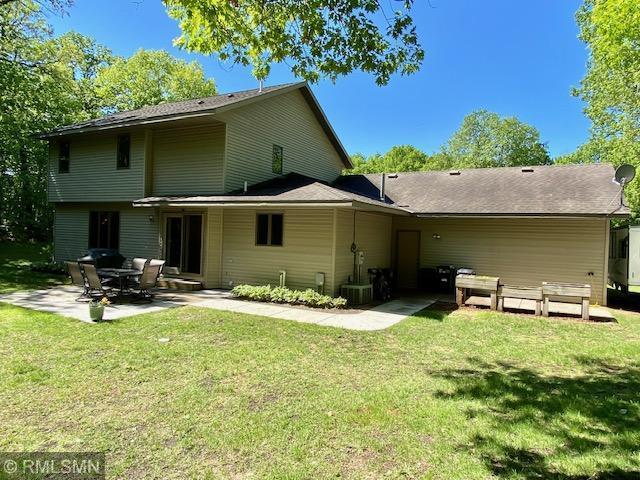 23110 Grandview Loop, Long Prairie Twp, MN 56347 - back of house with a patio area and a lawn