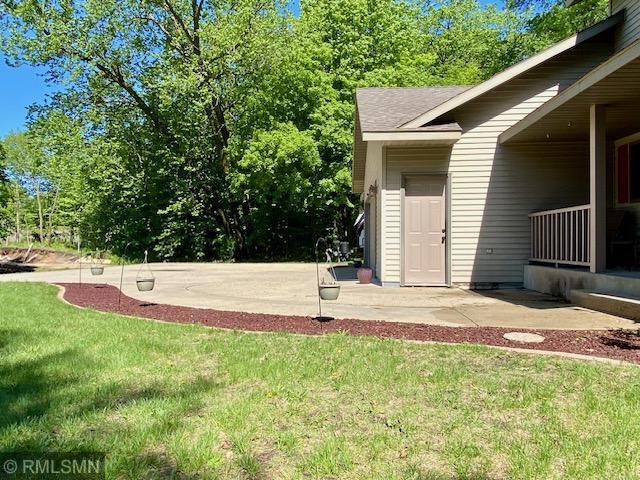 23110 Grandview Loop, Long Prairie Twp, MN 56347 - view of green lawn with a patio area and view of scattered trees
