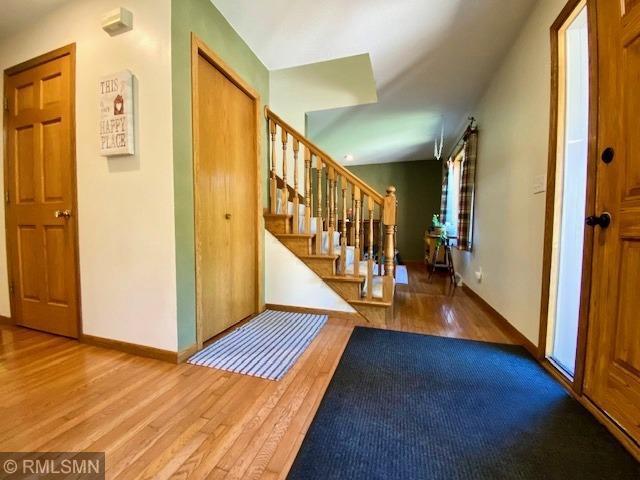 23110 Grandview Loop, Long Prairie Twp, MN 56347 - foyer featuring wood finished floors, baseboards, and stairs