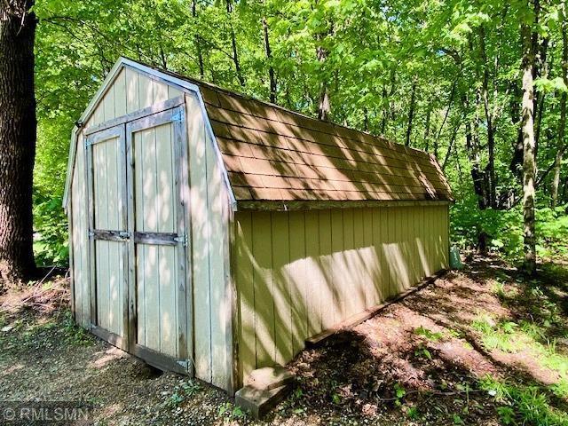 23110 Grandview Loop, Long Prairie Twp, MN 56347 - view of shed with a wooded view