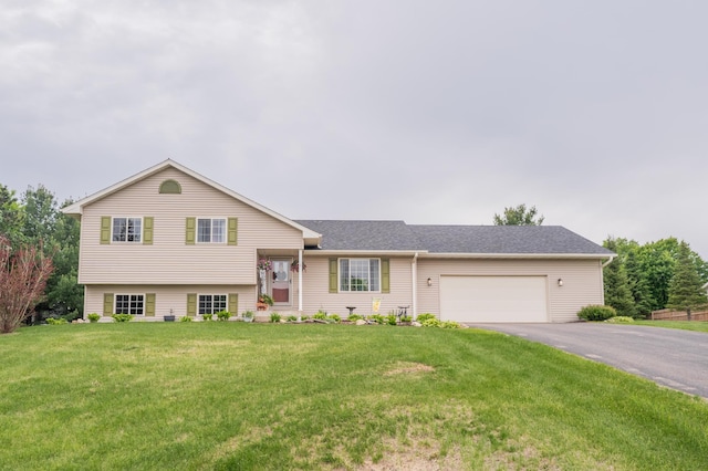 4064 135th St, Lake Hallie, WI 54729 - split level home featuring asphalt driveway, an attached garage, and a front lawn