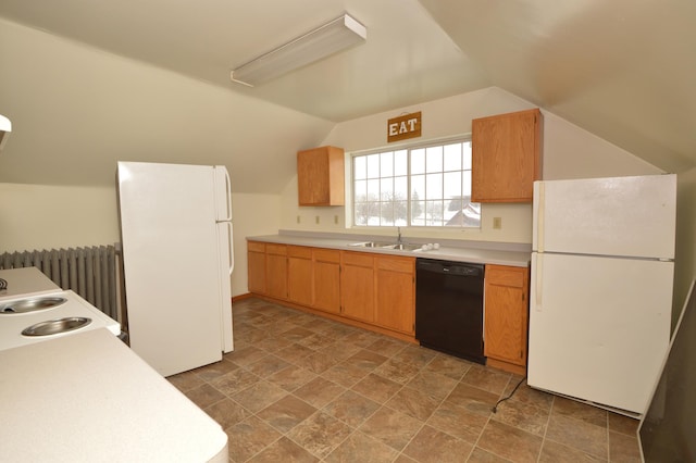 508 6th Ave S, Saint Cloud, MN 56301 - kitchen with dishwasher, freestanding refrigerator, a sink, vaulted ceiling, and radiator heating unit