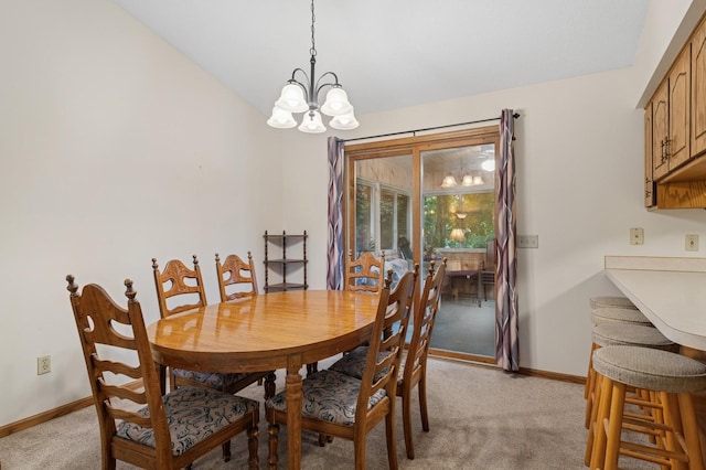 656 Mina Ct, Mahtomedi, MN 55082 - dining area featuring light colored carpet, a chandelier, and vaulted ceiling