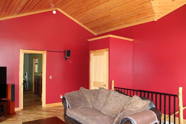 1729 Quail Ln NE, Longville, MN 56655 - living room featuring vaulted ceiling, wooden ceiling, wood finished floors, crown molding, and baseboards