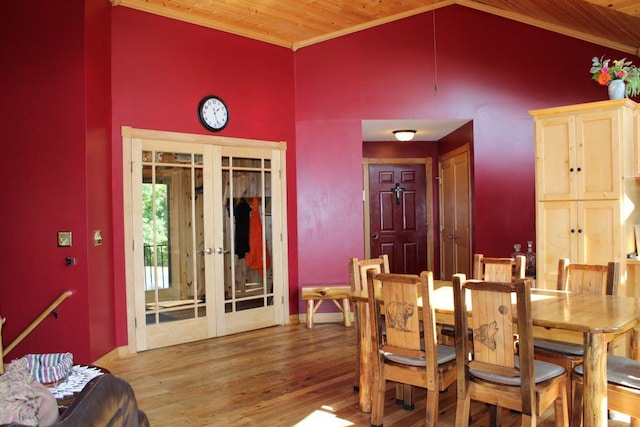 1729 Quail Ln NE, Longville, MN 56655 - dining room featuring french doors, wooden ceiling, wood finished floors, crown molding, and high vaulted ceiling