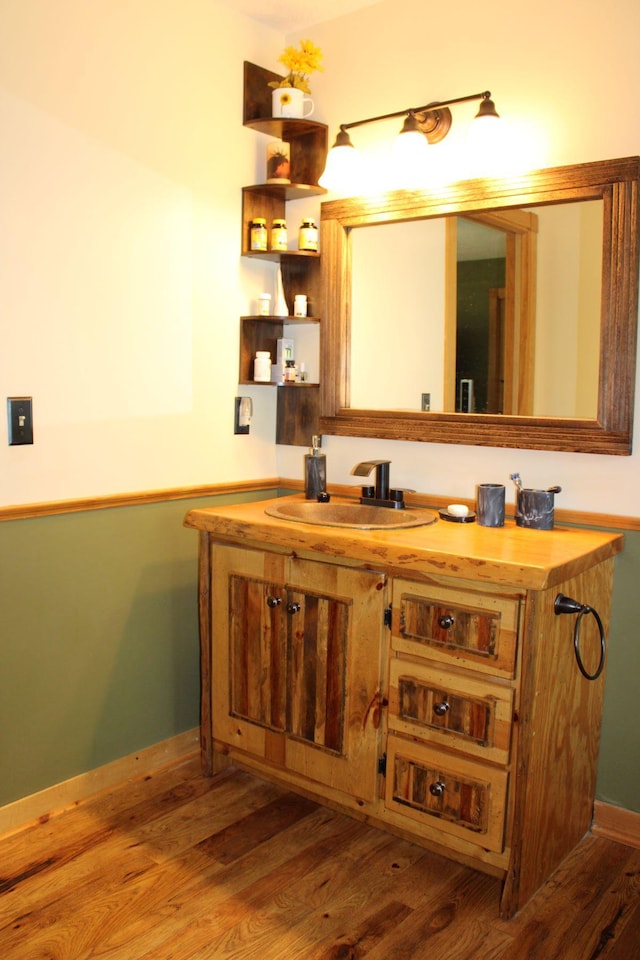 1729 Quail Ln NE, Longville, MN 56655 - bathroom with wood finished floors, vanity, and baseboards