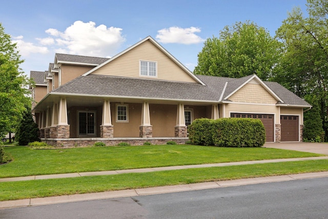 9885 Troy Ln N, Maple Grove, MN 55311 - craftsman-style house with stone siding, a garage, stucco siding, a shingled roof, and a front lawn