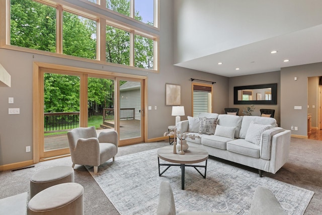 9885 Troy Ln N, Maple Grove, MN 55311 - carpeted living room with baseboards, a towering ceiling, and recessed lighting