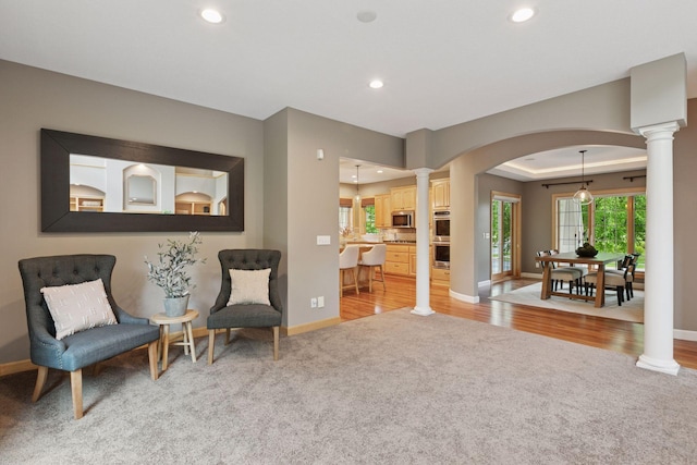 9885 Troy Ln N, Maple Grove, MN 55311 - sitting room with decorative columns, light carpet, baseboards, and recessed lighting