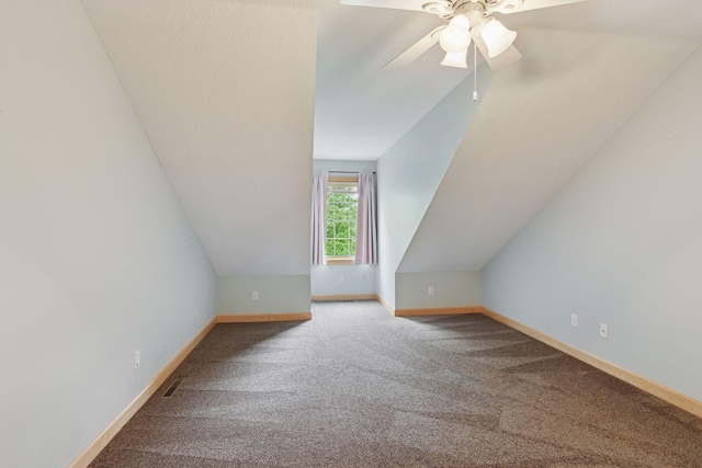 9885 Troy Ln N, Maple Grove, MN 55311 - additional living space featuring carpet, a ceiling fan, baseboards, and vaulted ceiling