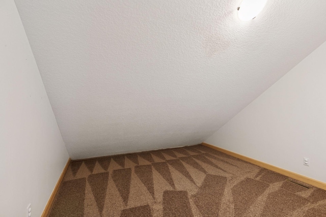 9885 Troy Ln N, Maple Grove, MN 55311 - carpeted empty room with baseboards and a textured ceiling